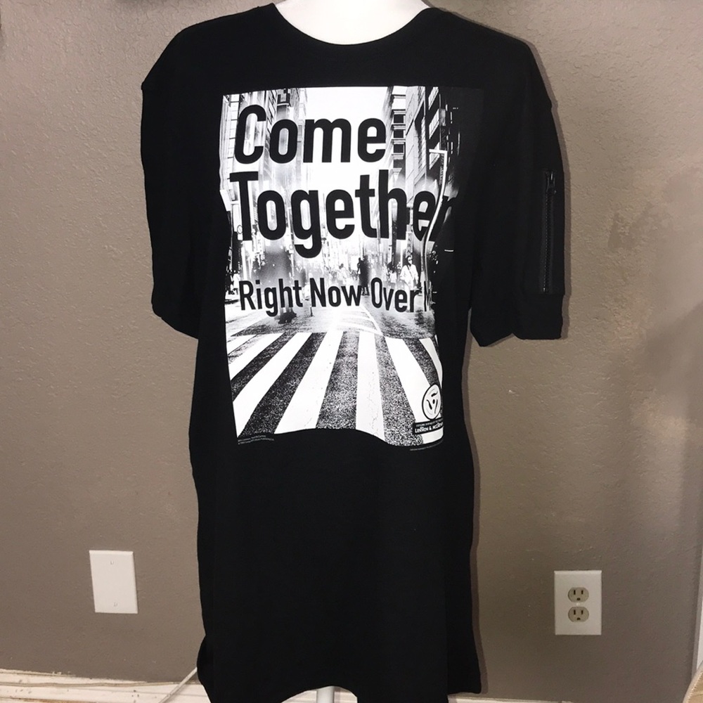 Beatles concert T-shirt.